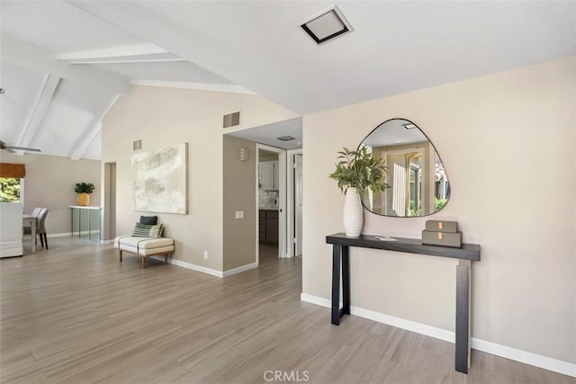 74 Tennis Club Dr, Rancho Mirage, CA 92270 - interior space with visible vents, lofted ceiling with beams, baseboards, and light wood-type flooring