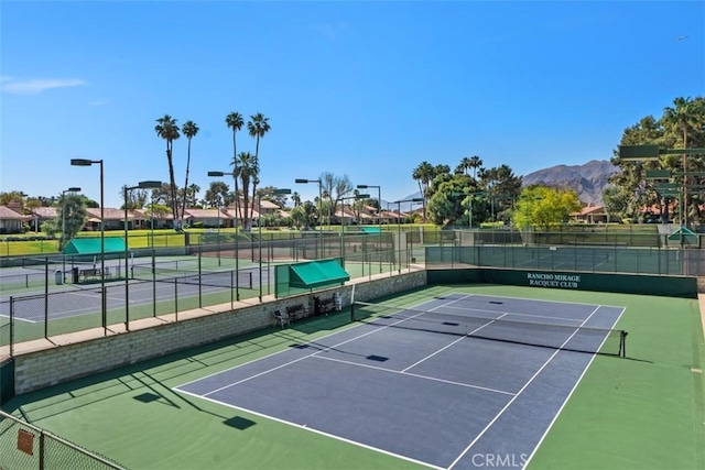 74 Tennis Club Dr, Rancho Mirage, CA 92270 - view of tennis court featuring a mountain view and fence