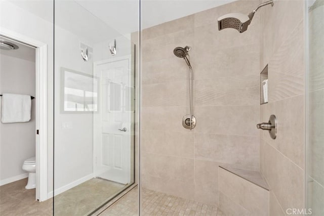 74 Tennis Club Dr, Rancho Mirage, CA 92270 - bathroom with toilet, tile patterned floors, and tiled shower