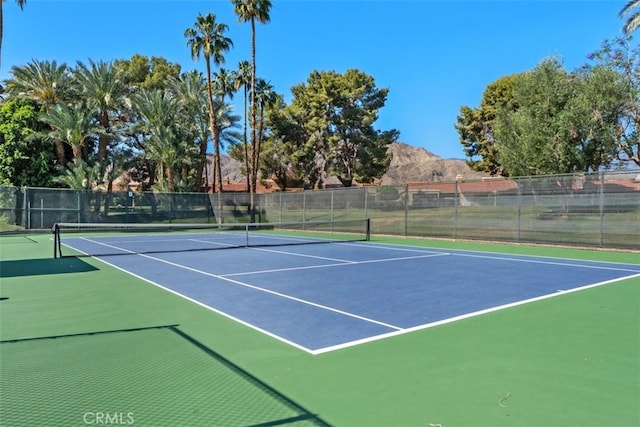 74 Tennis Club Dr, Rancho Mirage, CA 92270 - view of tennis court featuring fence, community basketball court, and a mountain view