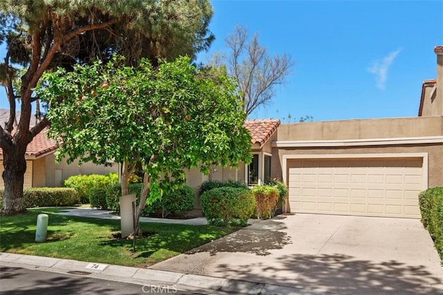 74 Tennis Club Dr, Rancho Mirage, CA 92270 - view of front of house with an attached garage, a tile roof, stucco siding, a front yard, and driveway