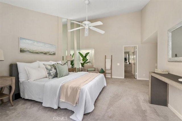 74 Tennis Club Dr, Rancho Mirage, CA 92270 - bedroom with high vaulted ceiling, baseboards, light carpet, and ceiling fan