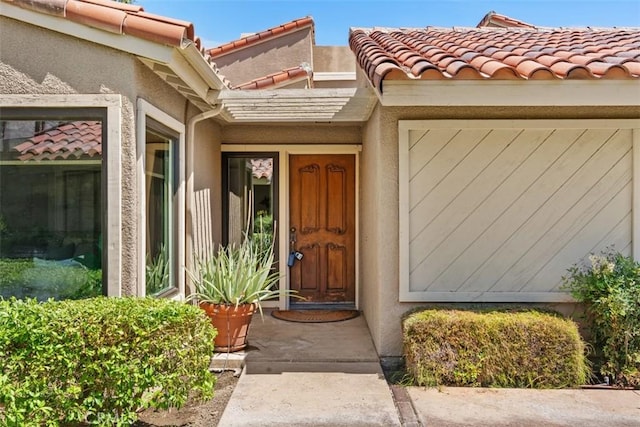 74 Tennis Club Dr, Rancho Mirage, CA 92270 - entrance to property with stucco siding and a tile roof