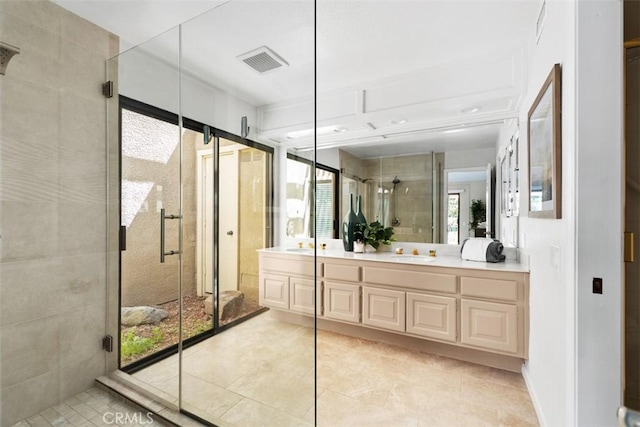 74 Tennis Club Dr, Rancho Mirage, CA 92270 - full bathroom featuring double vanity, visible vents, tile patterned flooring, a stall shower, and a sink