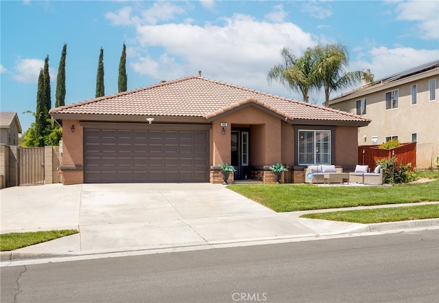 ranch-style house with an outdoor living space, a tile roof, fence, an attached garage, and stucco siding