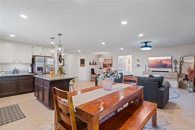 dining room featuring light tile patterned flooring and recessed lighting