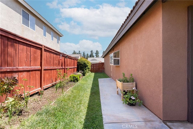 view of yard featuring a patio and a fenced backyard
