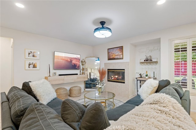 living area featuring a fireplace and recessed lighting