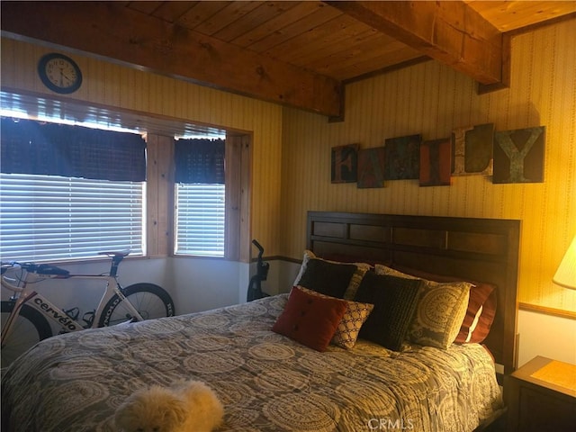bedroom featuring beamed ceiling and wood ceiling