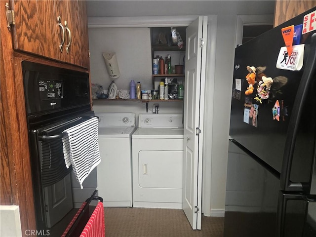 laundry area with washer and clothes dryer and laundry area