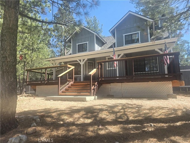 view of front of house featuring a shingled roof and board and batten siding