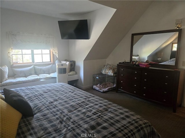 bedroom with carpet flooring, vaulted ceiling, and multiple windows