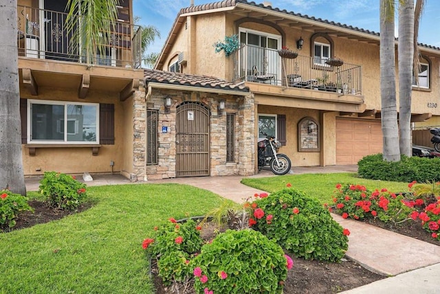4230 48th St Unit 5, San Diego, CA 92115 - mediterranean / spanish home featuring stucco siding, stone siding, a balcony, a front yard, and an attached garage
