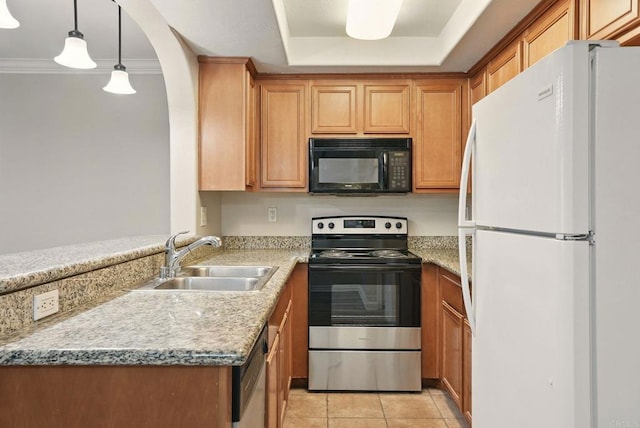 4230 48th St Unit 5, San Diego, CA 92115 - kitchen featuring arched walkways, light tile patterned floors, stainless steel appliances, a sink, and a tray ceiling