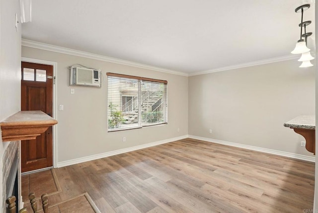 4230 48th St Unit 5, San Diego, CA 92115 - unfurnished living room featuring baseboards, ornamental molding, light wood-style floors, and a wall unit AC