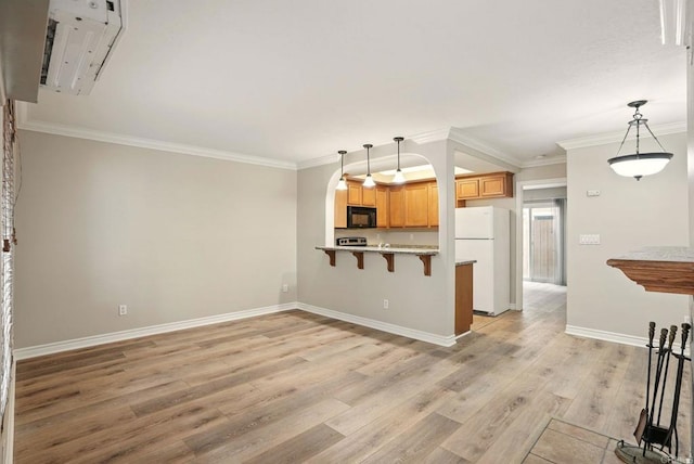 4230 48th St Unit 5, San Diego, CA 92115 - kitchen featuring freestanding refrigerator, light wood-type flooring, black microwave, a peninsula, and crown molding