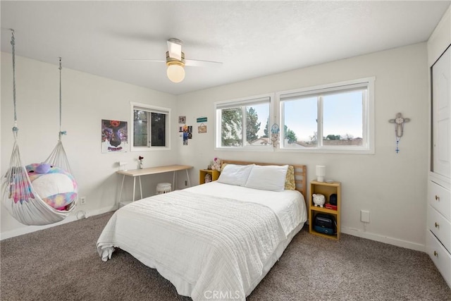 bedroom featuring a ceiling fan, carpet flooring, and baseboards