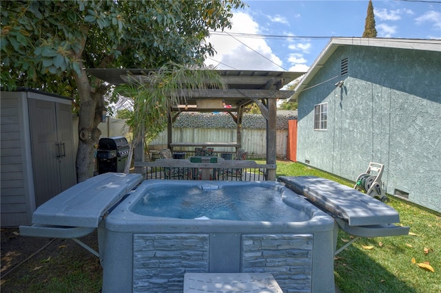 view of yard with a hot tub and fence