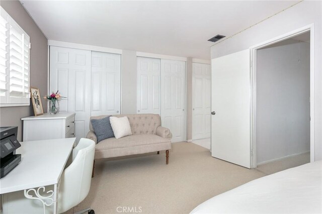 1337 Oakheath Dr, Harbor City, CA 90710 - bedroom featuring visible vents, light carpet, and multiple closets