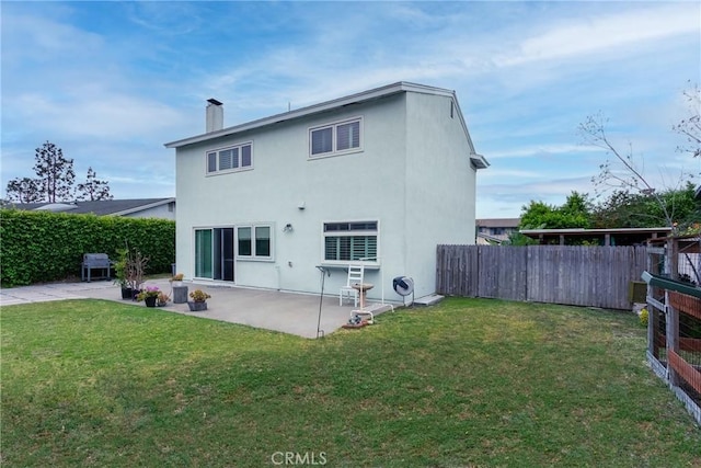1337 Oakheath Dr, Harbor City, CA 90710 - rear view of property with a patio, a lawn, a fenced backyard, and a chimney