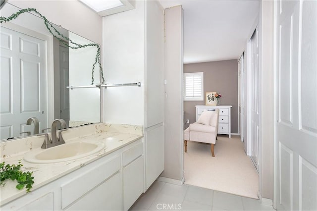1337 Oakheath Dr, Harbor City, CA 90710 - ensuite bathroom with baseboards, connected bathroom, and vanity