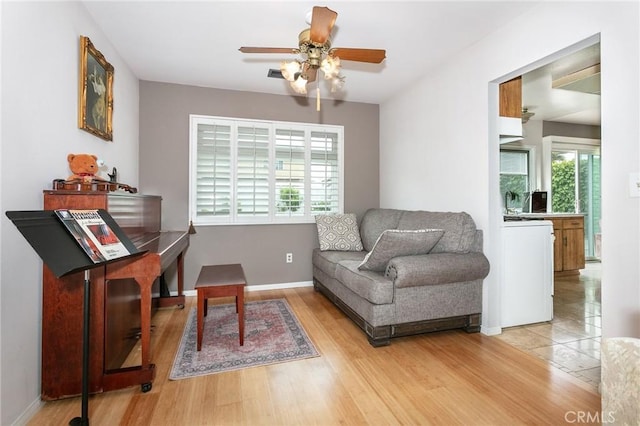 1337 Oakheath Dr, Harbor City, CA 90710 - living area with a ceiling fan, wood finished floors, and baseboards