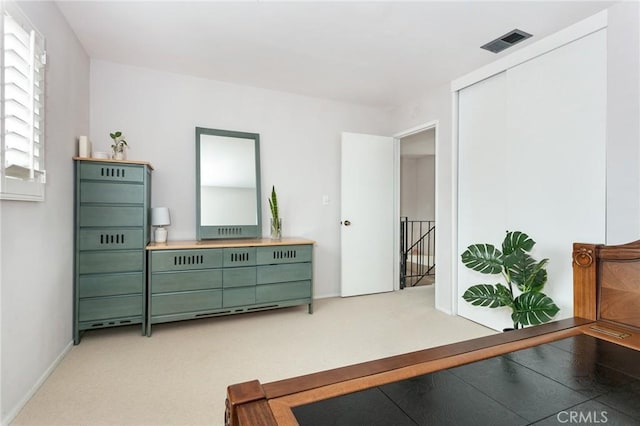 1337 Oakheath Dr, Harbor City, CA 90710 - living area featuring an upstairs landing, visible vents, light carpet, and baseboards