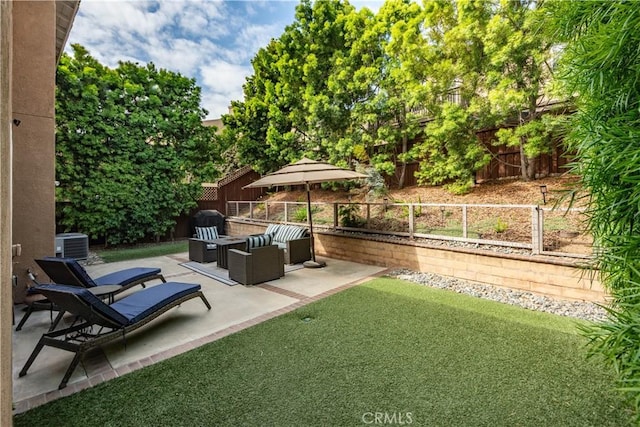 view of yard featuring a fenced backyard, a patio, cooling unit, and an outdoor living space