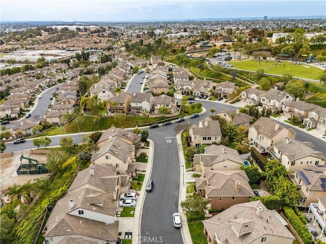 birds eye view of property with a residential view