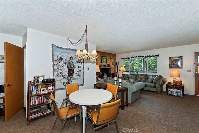 carpeted dining area with a textured ceiling and a chandelier
