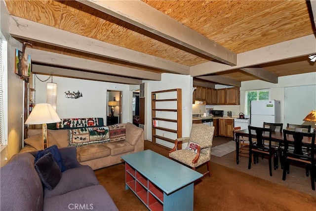 carpeted living area with beam ceiling and wood ceiling
