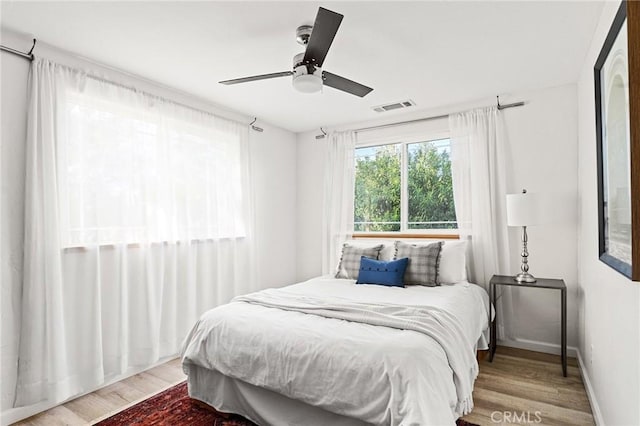 5222 Foster Rd, Paradise, CA 95969 - bedroom with a ceiling fan, baseboards, visible vents, and wood finished floors