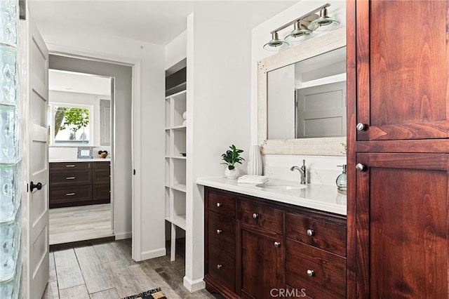 5222 Foster Rd, Paradise, CA 95969 - bathroom featuring vanity, baseboards, and wood finished floors