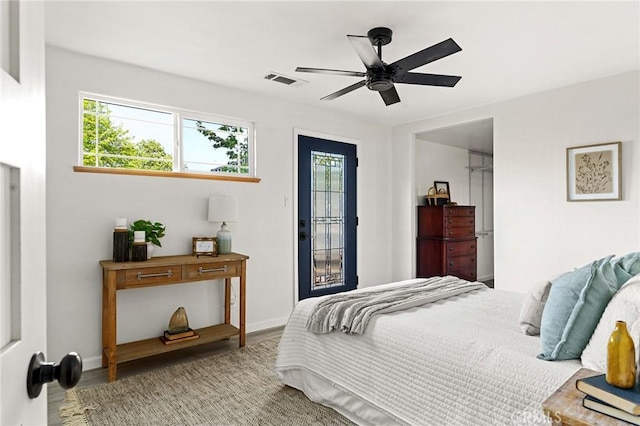 5222 Foster Rd, Paradise, CA 95969 - bedroom featuring baseboards, visible vents, multiple windows, and wood finished floors