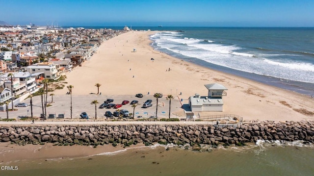 birds eye view of property featuring a view of the beach and a water view