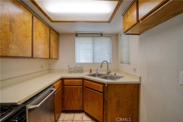 10710 El Camino Real Unit 26, Atascadero, CA 93422 - kitchen featuring stainless steel dishwasher, black range, brown cabinetry, light countertops, and a sink