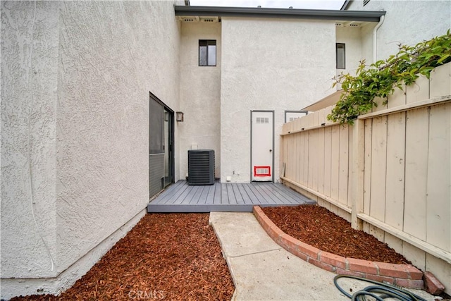 10710 El Camino Real Unit 26, Atascadero, CA 93422 - rear view of property featuring fence, cooling unit, and stucco siding