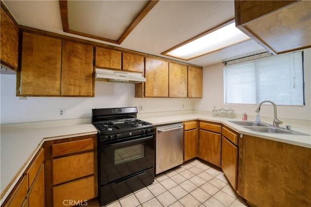 10710 El Camino Real Unit 26, Atascadero, CA 93422 - kitchen featuring stainless steel dishwasher, under cabinet range hood, brown cabinets, a sink, and black range with gas stovetop