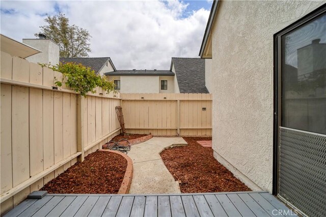 10710 El Camino Real Unit 26, Atascadero, CA 93422 - view of yard with a deck and a fenced backyard