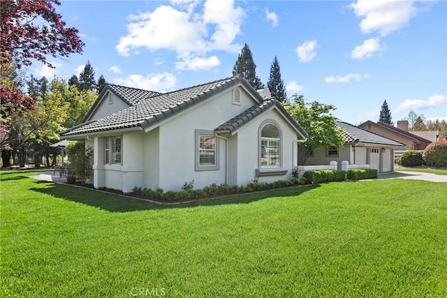 1609 Tanager Ct, Templeton, CA 93465 - view of property exterior with a garage, stucco siding, a tiled roof, concrete driveway, and a lawn