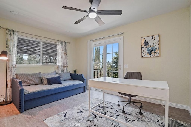 2161 Stonefield Pl, Riverside, CA 92506 - home office with baseboards, ceiling fan, and wood finished floors