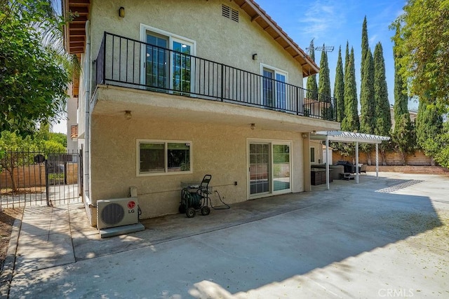 2161 Stonefield Pl, Riverside, CA 92506 - back of property featuring fence, ac unit, a balcony, and stucco siding