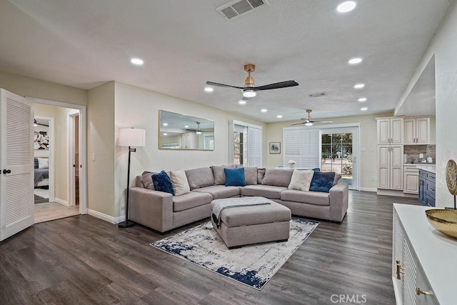 2161 Stonefield Pl, Riverside, CA 92506 - living area with visible vents, dark wood-type flooring, baseboards, and ceiling fan