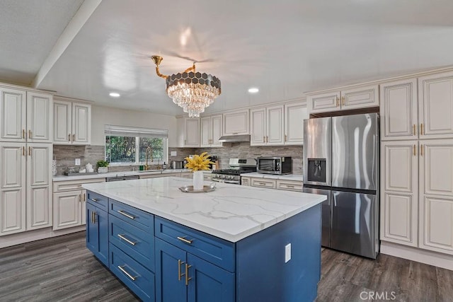 2161 Stonefield Pl, Riverside, CA 92506 - kitchen featuring blue cabinetry, appliances with stainless steel finishes, a center island, under cabinet range hood, and dark wood-type flooring