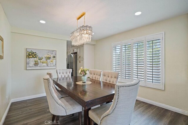 2161 Stonefield Pl, Riverside, CA 92506 - dining room featuring a chandelier, baseboards, and dark wood finished floors