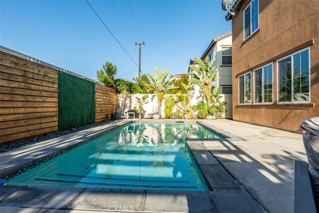 54 Revell Cir, Buena Park, CA 90620 - view of pool with a fenced backyard and a patio area
