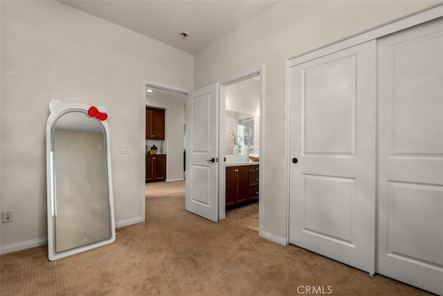 54 Revell Cir, Buena Park, CA 90620 - unfurnished bedroom with light carpet, baseboards, connected bathroom, and a closet