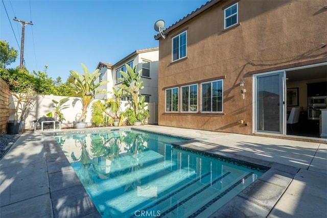 54 Revell Cir, Buena Park, CA 90620 - view of swimming pool with a fenced backyard and a patio area