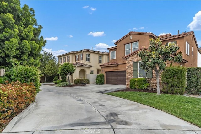54 Revell Cir, Buena Park, CA 90620 - mediterranean / spanish home with stucco siding, concrete driveway, a tile roof, and a garage