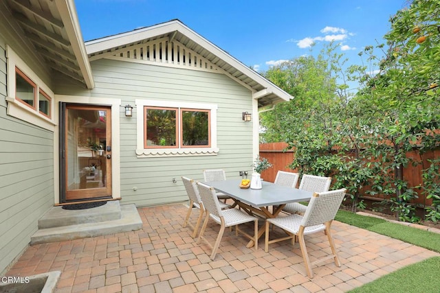 view of patio / terrace with outdoor dining area and fence